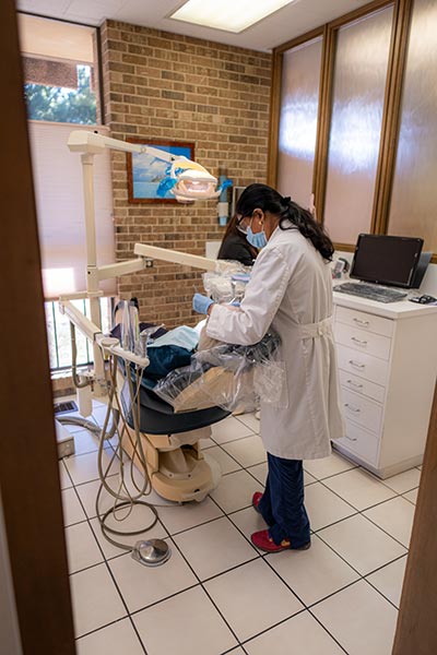 Oral surgery patient in room receiving procedure in Fort Worth, TX
